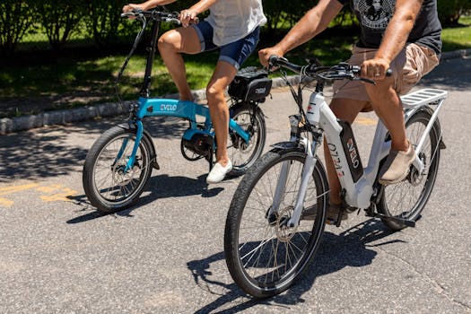 A couple enjoying a ride on electric bikes during a sunny day in Patchogue, NY.